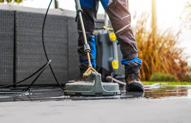 Office cleaners vacuuming and wiping desks